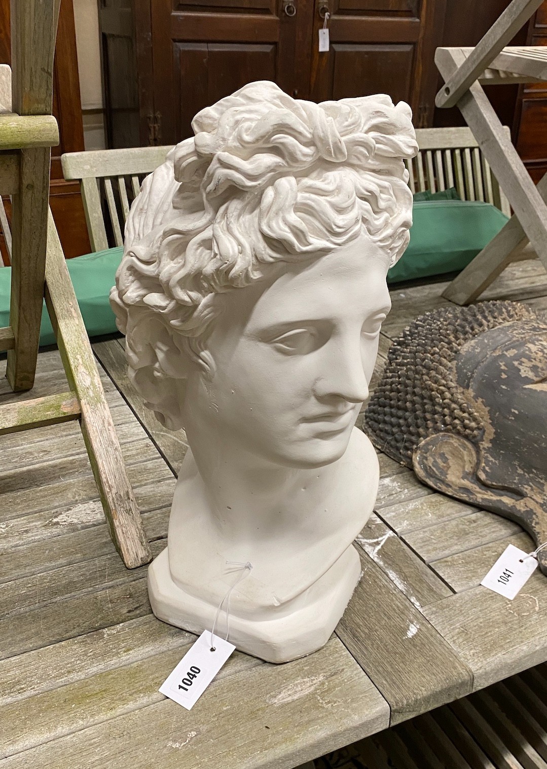 A plaster bust of Apollo, height 49cm